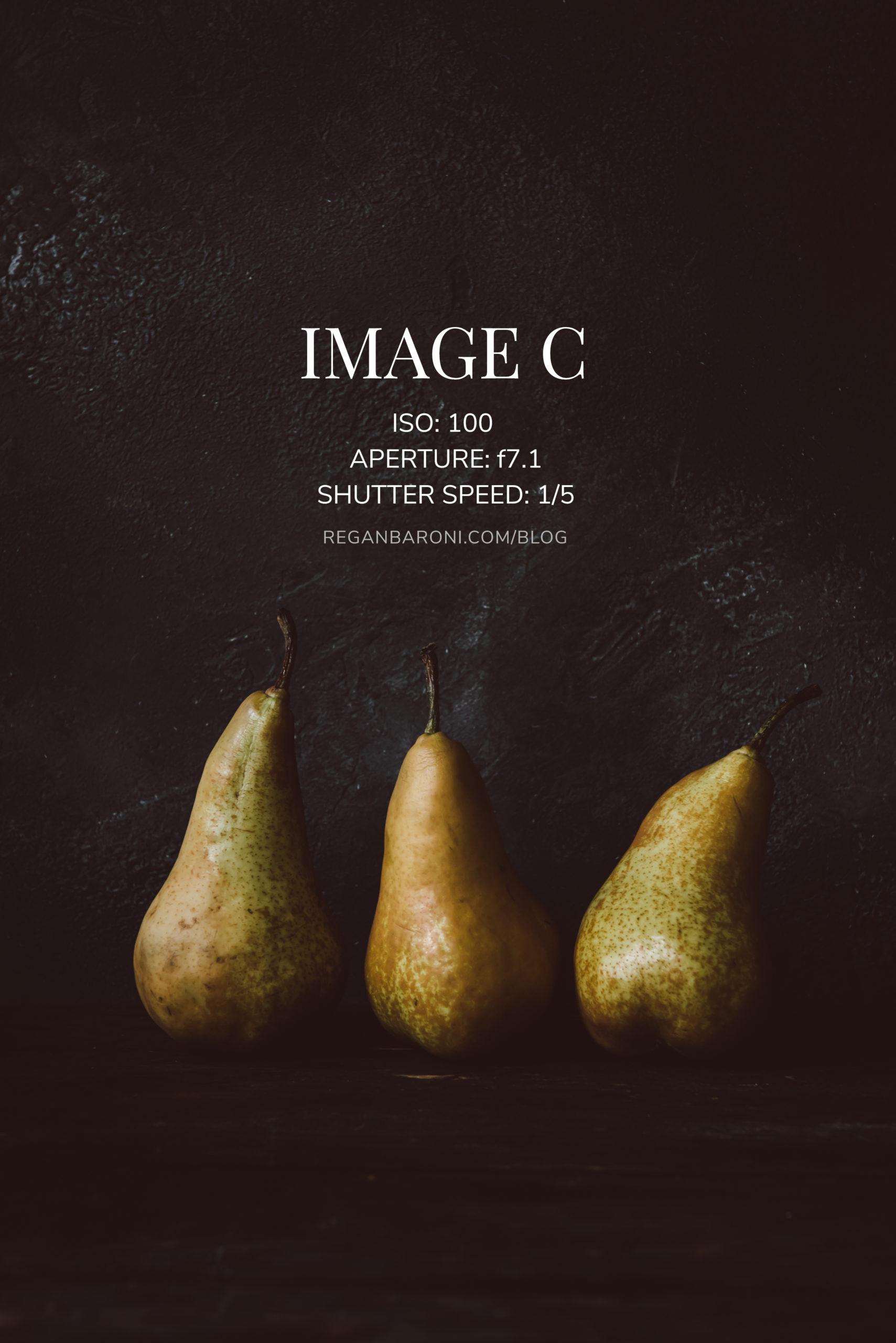 three pears on a dark background