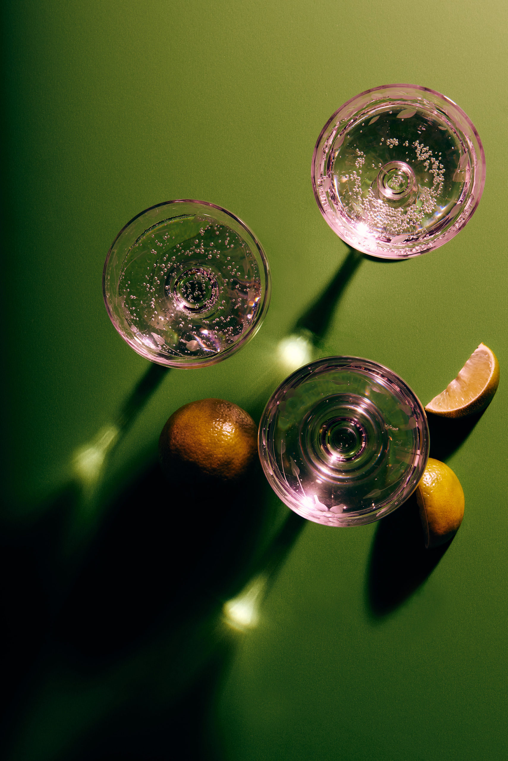 glasses on a green surface